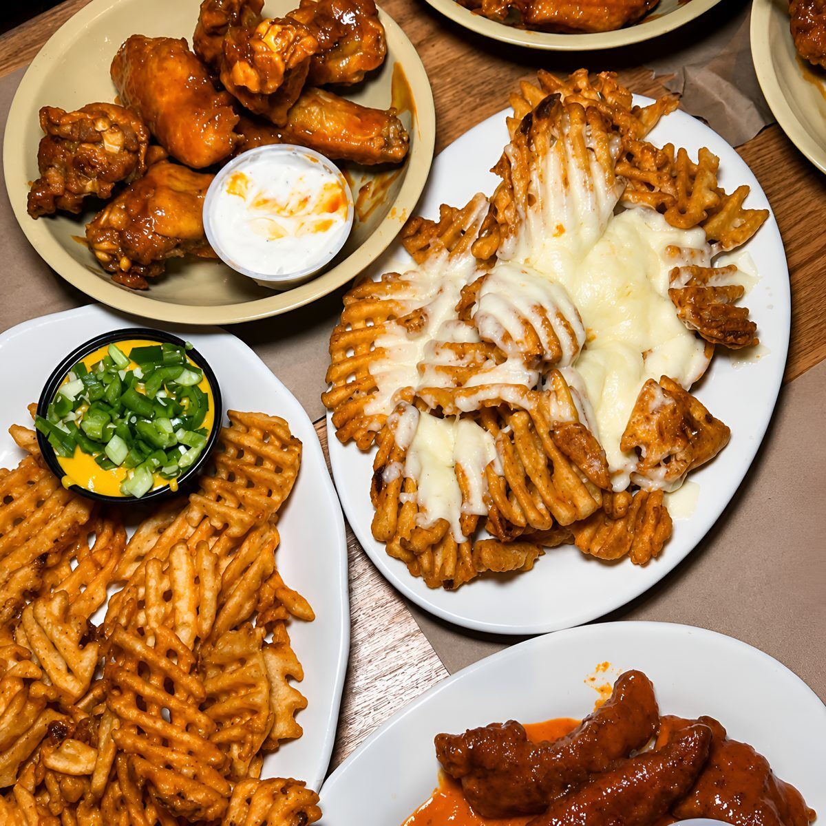 Catering trays of Candlelight Inn wings and comfort food