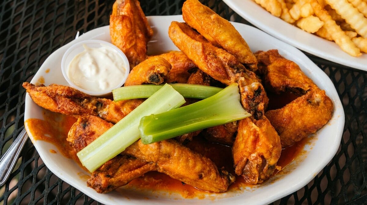Close-up of Candlelight Inn buffalo wings with celery and blue cheese